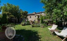 Farmhouse in the center with garden