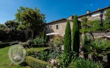 Farmhouse in the center with garden