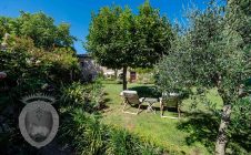 Farmhouse in the center with garden