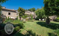 Farmhouse in the center with garden